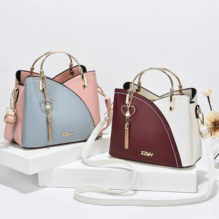 Sophisticated navy blue PU leather bucket crossbody bag with elegant patchwork design and adjustable strap