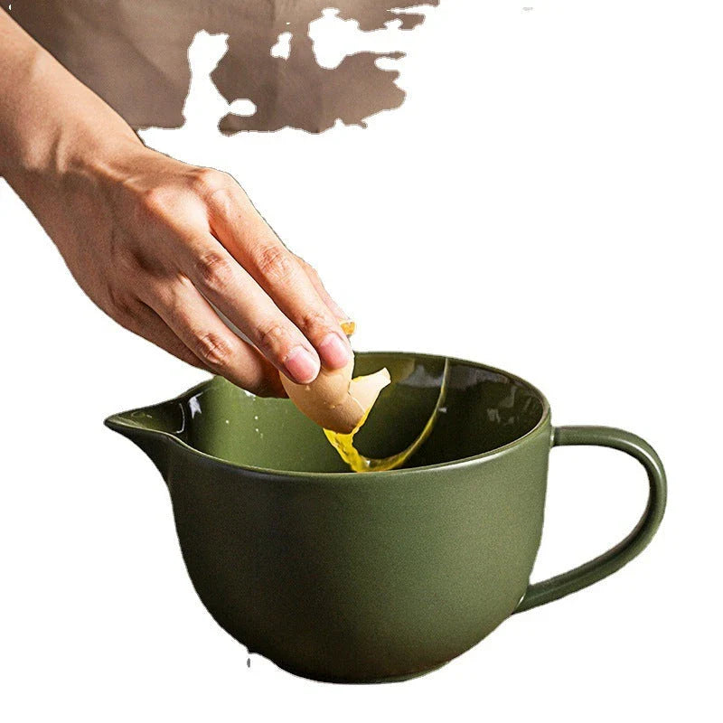 Premium porcelain mixing bowl with ergonomic handle and pointed drainage design for easy baking at home