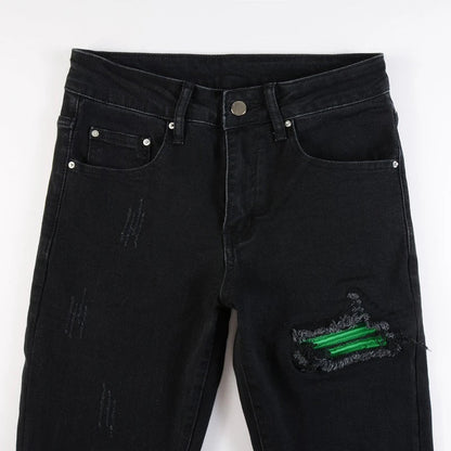Premium ripped black jeans with stylish green patchwork design, made with medium-elastic fabric for comfort and a slim, flattering silhouette.