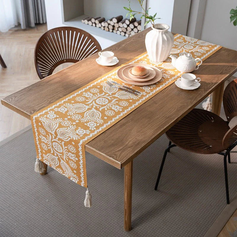 A beautifully crafted jacquard-woven table runner with a geometric pattern in contrasting colours, perfect for elevating your home decor