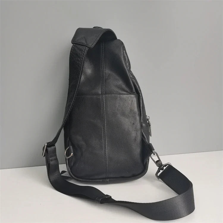 Premium black leather chest bag with zipper closure, adjustable strap, and ample storage space for everyday essentials