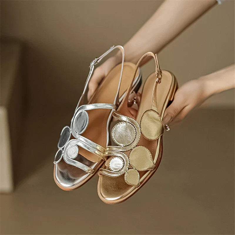 Chic sheepskin round toe sandals with chunky heel and stylish cutout design, perfect for the modern British woman