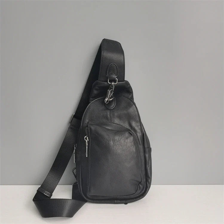 Premium black leather chest bag with zipper closure, adjustable strap, and ample storage space for everyday essentials