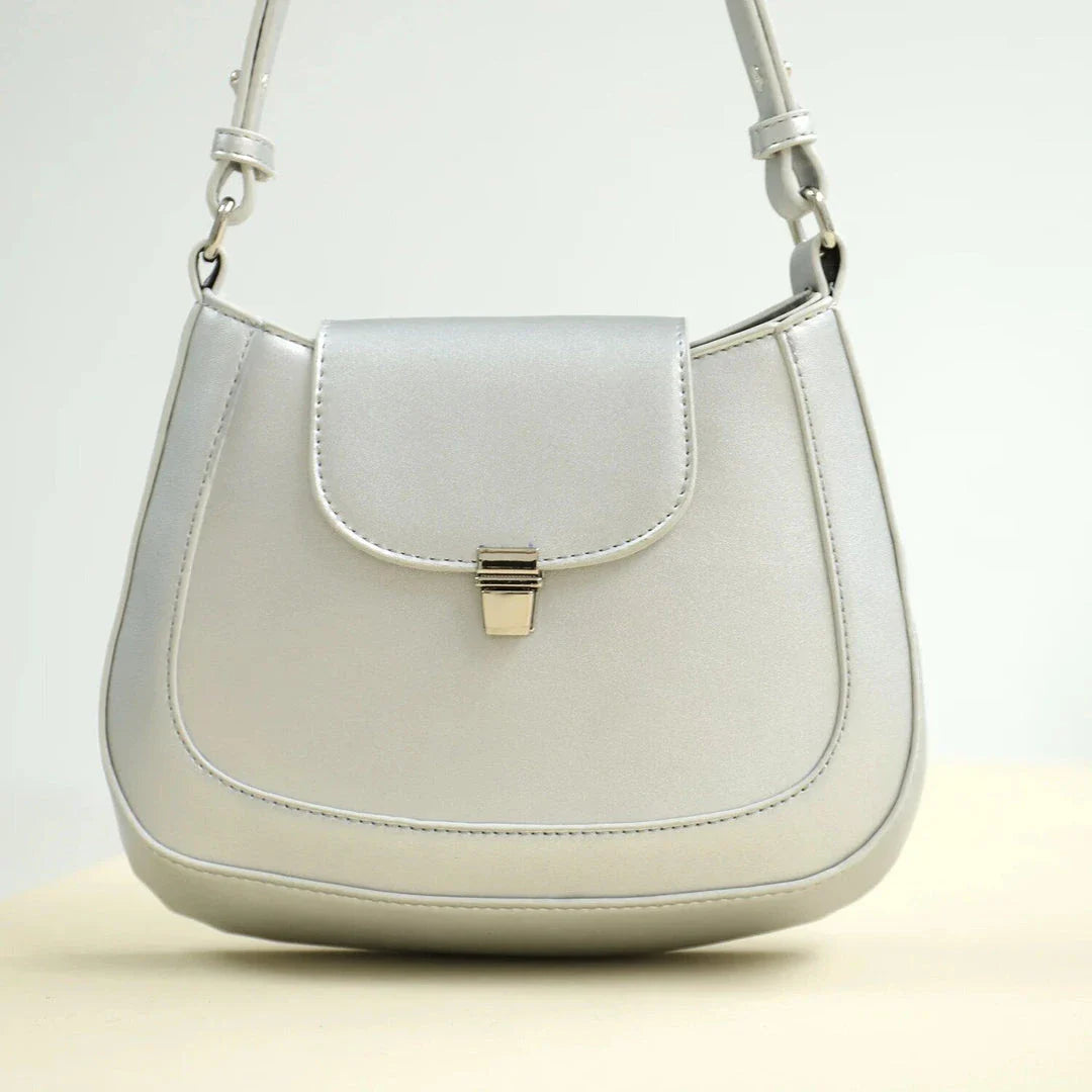 Elegant and versatile vegan leather shoulder bag with adjustable strap, flap cover, and interior pockets for modern British women