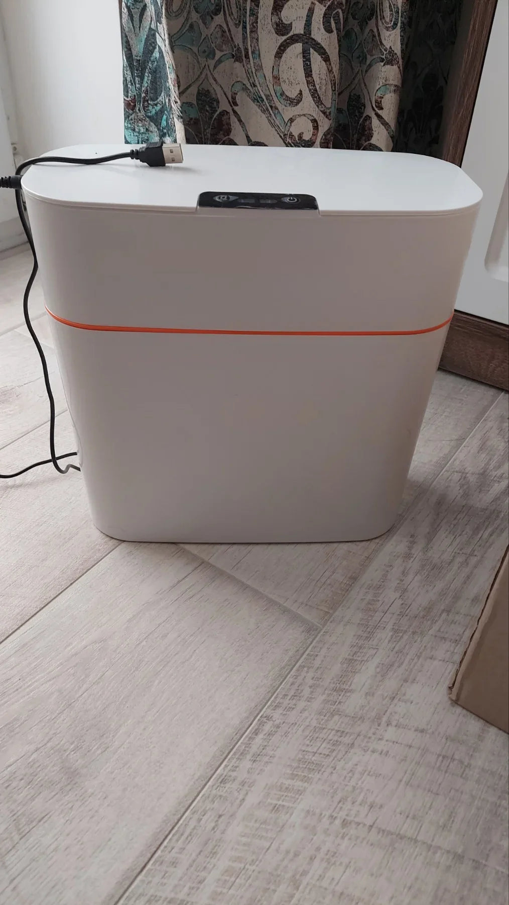Sensor-powered bin with sleek design and touch-free motion-activated lid for effortless, hygienic waste disposal