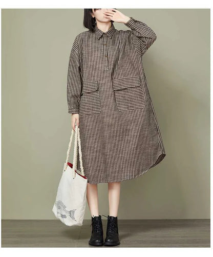 Plus-size women's dress with a striped pattern, asymmetric skirt, and long loose sleeves