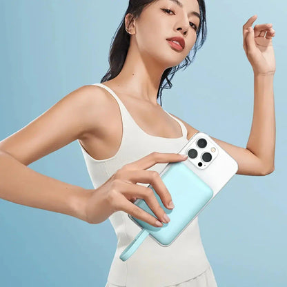 High-capacity magnetic power bank with wireless fast charging and built-in cables, providing 10,000mAh of reliable power for mobile devices.