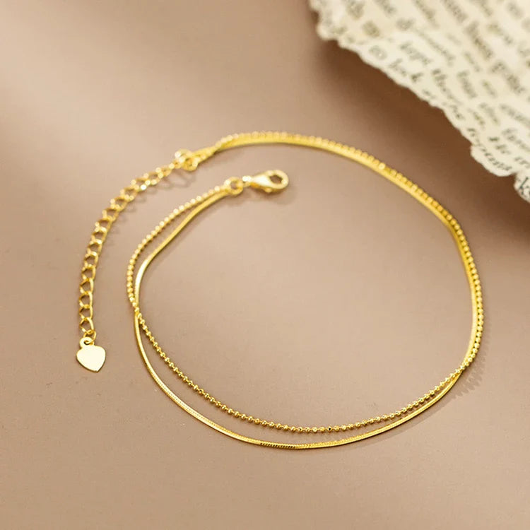 Elegant 14K gold-plated sterling silver anklet with intricate floral pattern and adjustable length