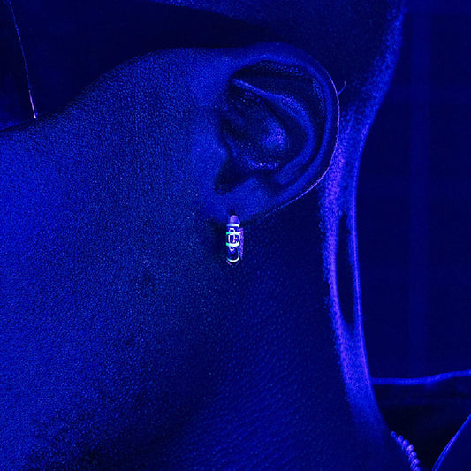Sterling silver earrings with luminous accents, providing a soft, gentle glow for a touch of elegant sophistication.