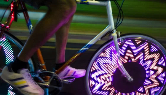 Bicycle Wheel Flashing Light with 32 LED lights in red, blue, and green colours that create a mesmerizing light show