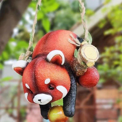 Charming resin raccoon statue climbing a decorative rope, adding a whimsical and nature-inspired touch to your outdoor or indoor spaces