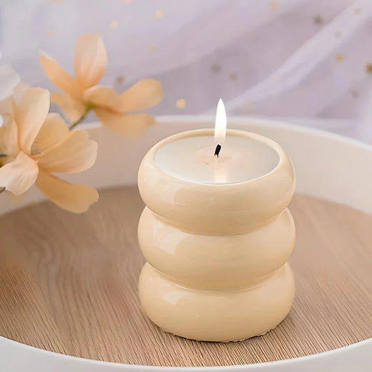 A white ceramic candlestick holder with a minimalist Nordic design, perfect for creating a cosy and sophisticated ambience in any room.