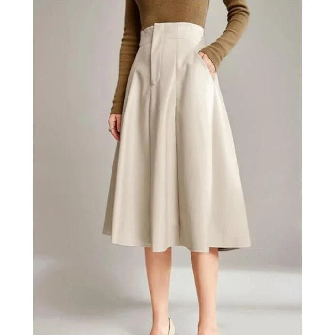 High-waist, A-line black PU leather skirt with a knee-length design for a sophisticated, elegant look