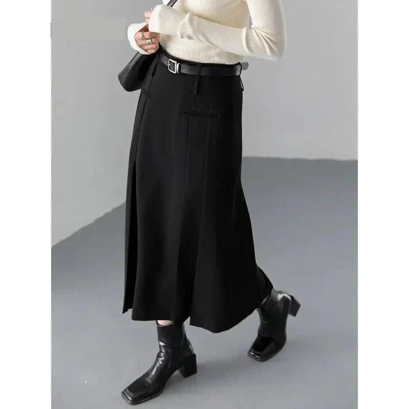 Elegant high-waisted pleated a-line skirt with a flattering silhouette and practical pockets, ideal for autumn and winter in the UK