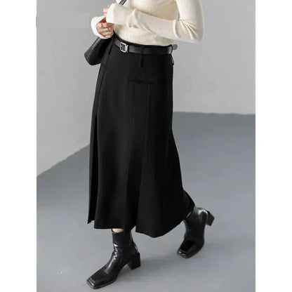 Elegant high-waisted pleated a-line skirt with a flattering silhouette and practical pockets, ideal for autumn and winter in the UK