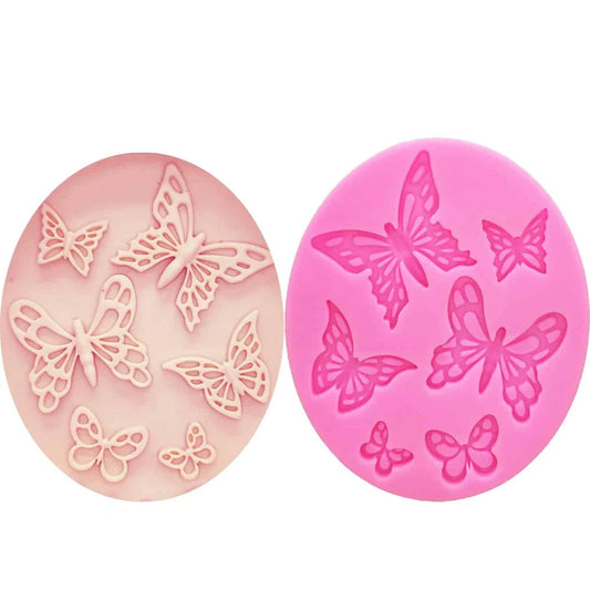 A pink butterfly-shaped silicone fondant mould for creating detailed and intricate fondant decorations