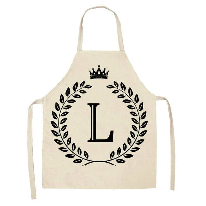 A high-quality kitchen apron featuring a charming crown and letter print design in a premium cotton and linen blend fabric.