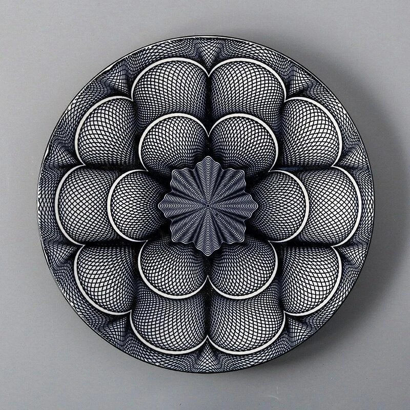 Elegant ceramic plates with vibrant, whimsical prints in a variety of enchanting designs