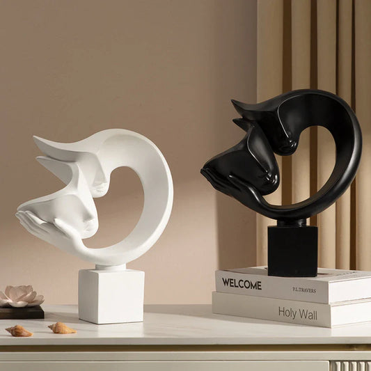 Elegant minimalist resin bogu wall shelf in white and black colours, with decorative items displayed on the shelf