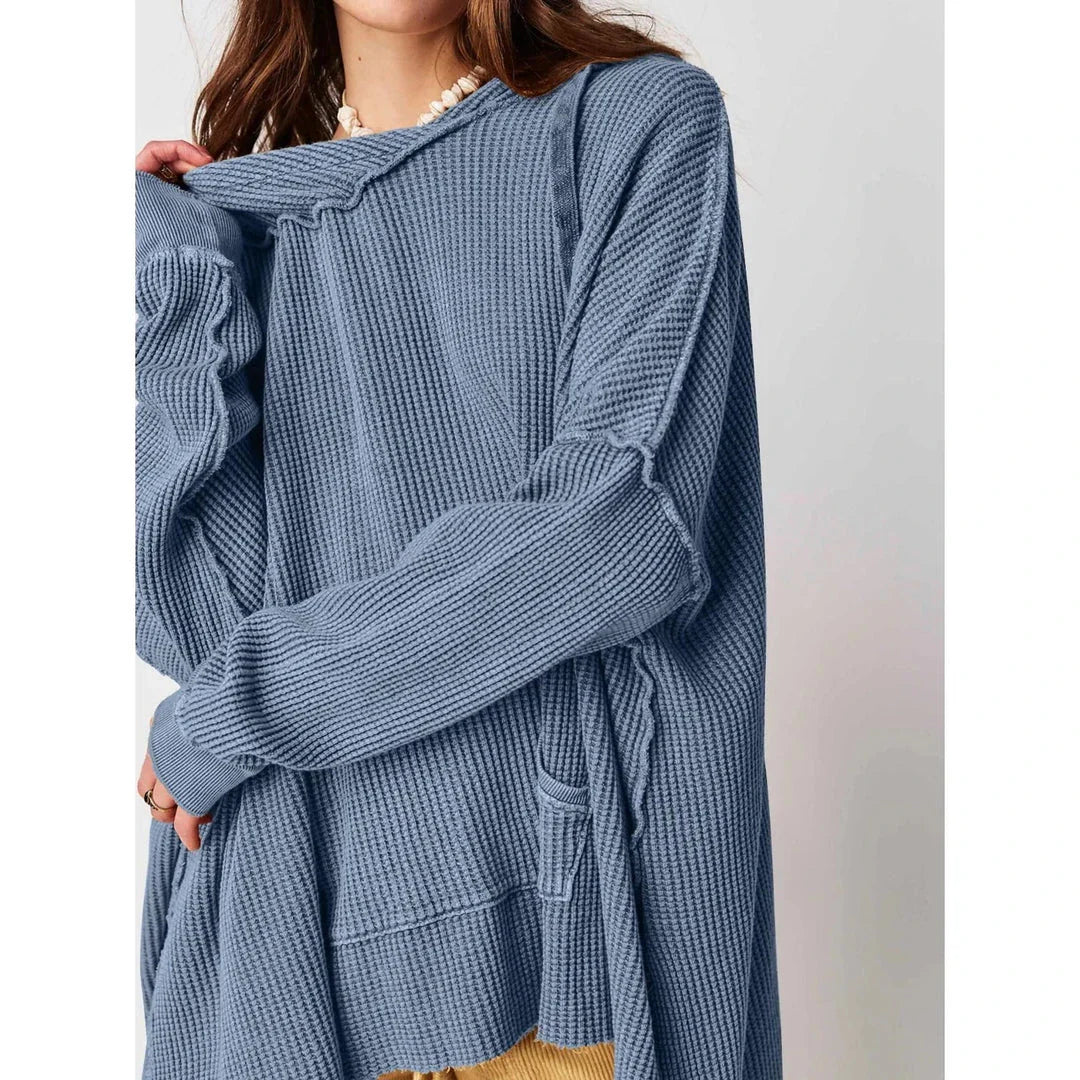 Cosy and stylish oversized hoodie with practical pockets for women, available in black, charcoal grey, and navy blue