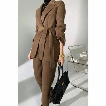 Elegant autumn-winter woollen pant suit with belted jacket and warm trousers for women