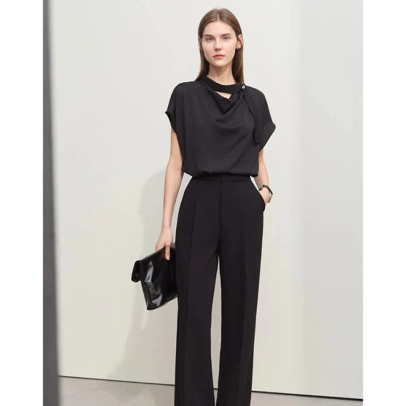Elegant minimalist women's summer blouse in blue chiffon fabric with tie sleeves and hollow-out decoration
