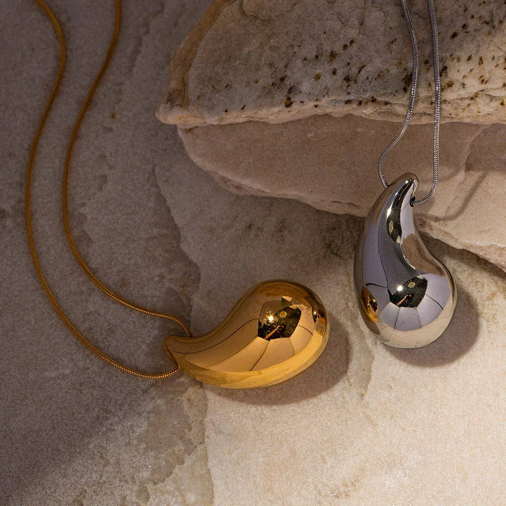 Elegant gold-plated stainless steel necklace with a large, sparkling waterdrop-shaped pendant