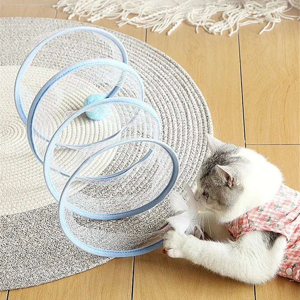Folding cat play tunnel with various toys like balls, feathers, and mice attached to the sides