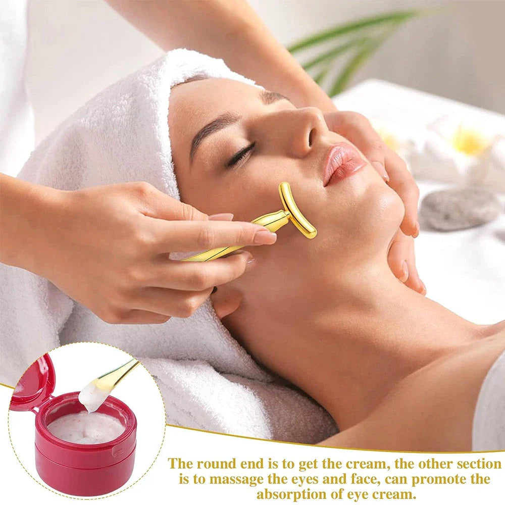 A rose gold metal eye cream applicator and face massager tool with a Y-shaped design for effective skincare application and facial massage