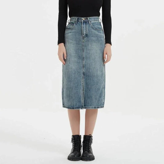 A high-waist denim pencil skirt with a classic A-line silhouette, perfect for the modern British woman.