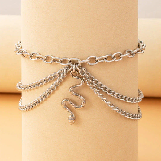 A stylish gold boho anklet with delightful tassels, starfish, and heart charms, perfect for summer outings and everyday wear.