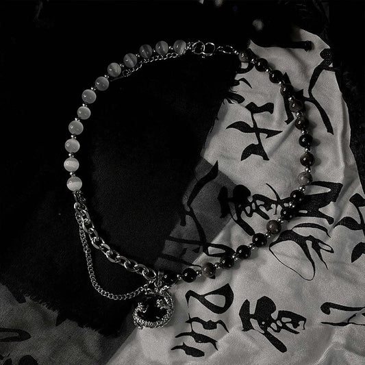 Titanium steel necklace with a black agate pendant featuring an intricate dragon design
