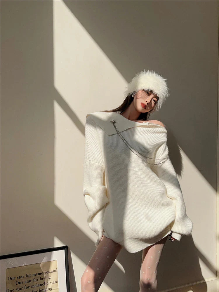 Luxurious off-the-shoulder zipper sweater in black and beige, featuring lantern sleeves and a cozy alpaca wool blend