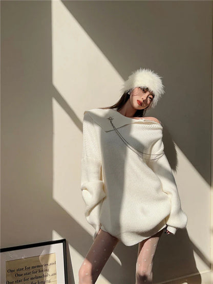 Luxurious off-the-shoulder zipper sweater in black and beige, featuring lantern sleeves and a cozy alpaca wool blend