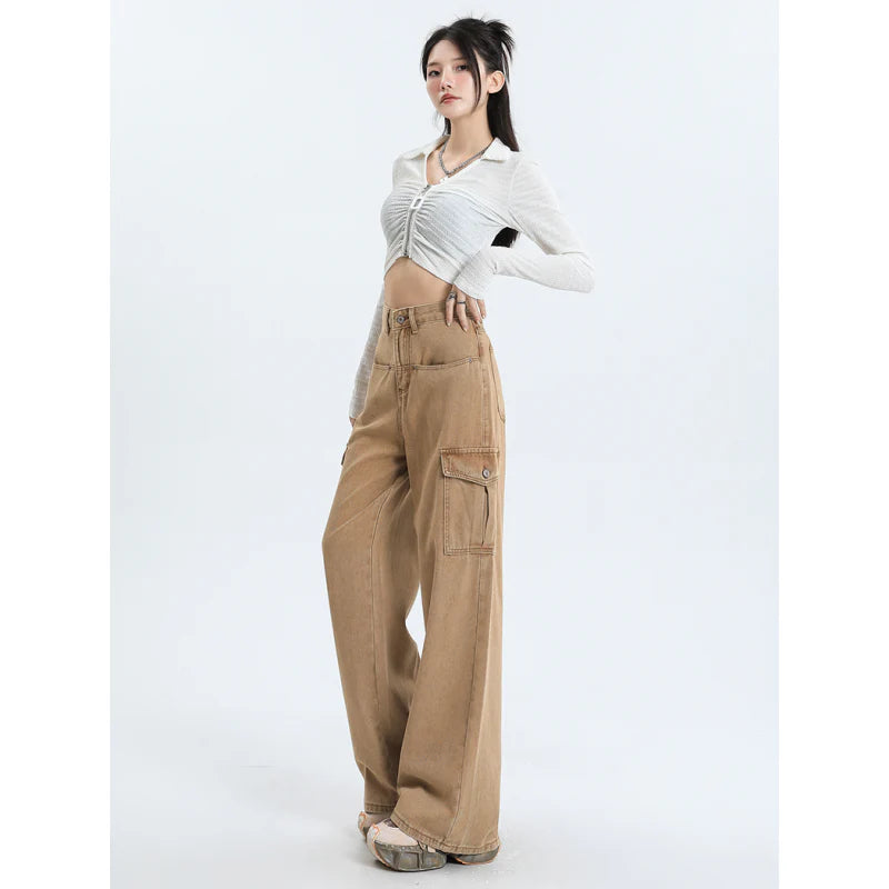 A pair of pink high-waist baggy jeans with a straight-leg design, featuring vintage-inspired details like buttons and faux zippers.