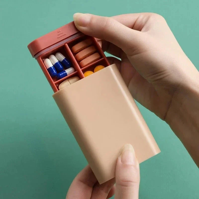 Compact 7-day portable pill organiser with six grids for storing daily medications, supplements, and vitamins