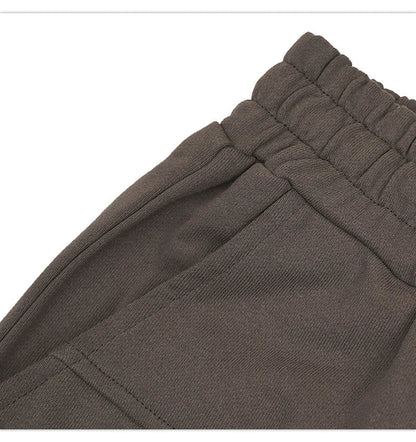 Premium loose-fit sports shorts with eye-catching printed patterns in black, khaki, and dark grey colours