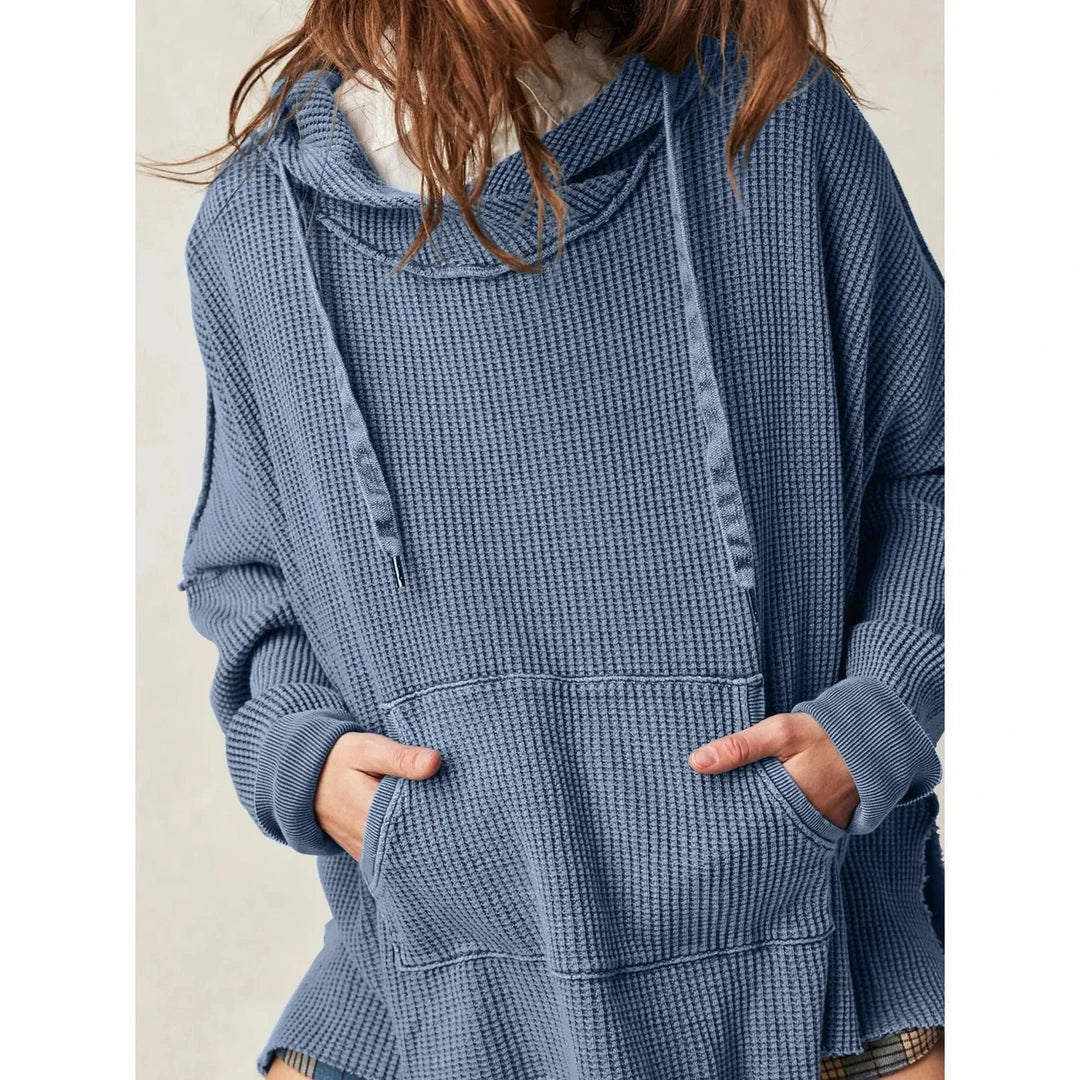 Cosy and stylish oversized hoodie with practical pockets for women, available in black, charcoal grey, and navy blue