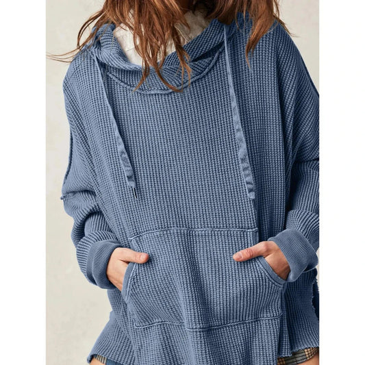 Cosy and stylish oversized hoodie with practical pockets for women, available in black, charcoal grey, and navy blue