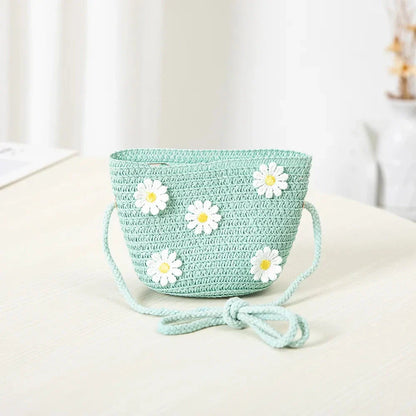 Charming kids' sun hat and handbag set with a daisy print design, offering sun protection and style for outdoor adventures.