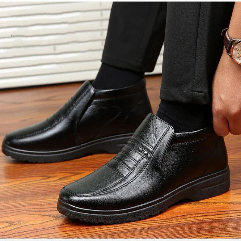 Premium cotton leather men's ankle boots in black and brown, featuring plush lining and durable rubber sole for warmth and stability in cold weather