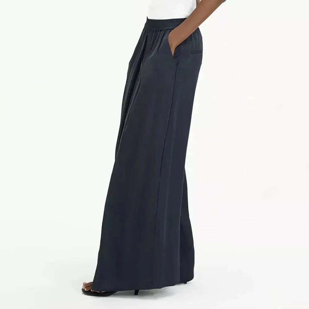 Chic navy high-waist wide-leg trousers with elegant patchwork design, offering timeless sophistication and modern style.