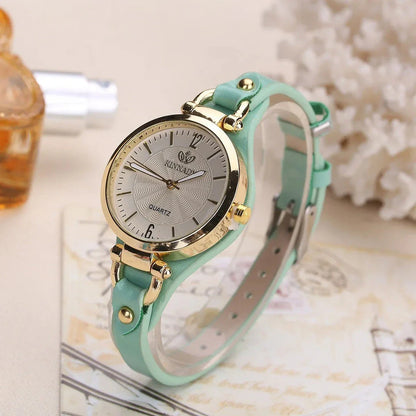 Elegant leather strap quartz watch with a sleek alloy case and durable glass dial for everyday elegance