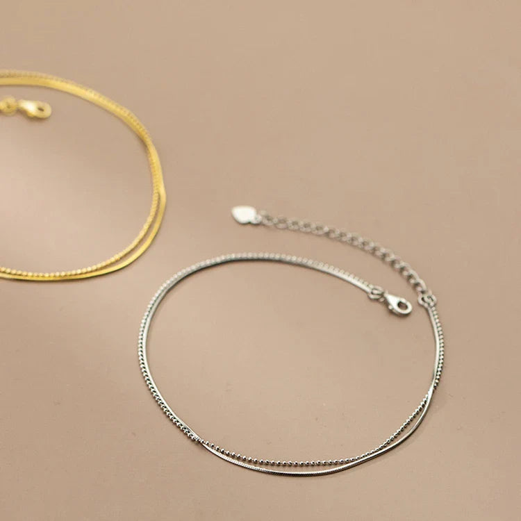 Elegant 14K gold-plated sterling silver anklet with intricate floral pattern and adjustable length