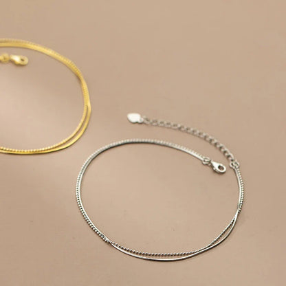 Elegant 14K gold-plated sterling silver anklet with intricate floral pattern and adjustable length