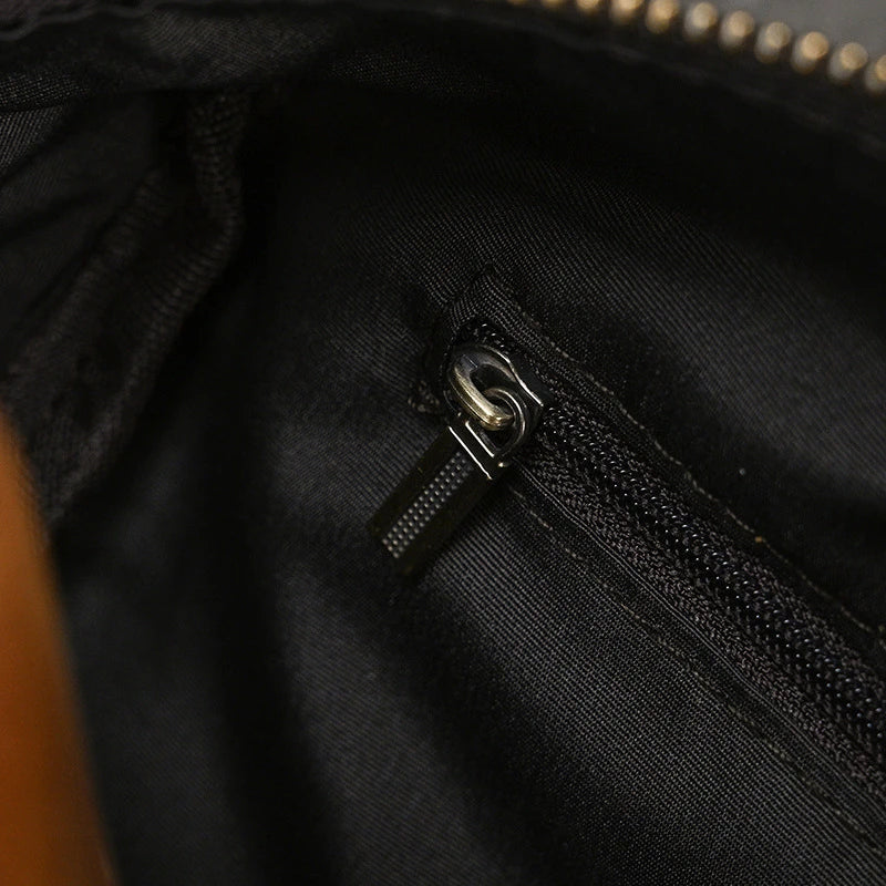 Premium leather clutch bag with multiple interior pockets, designed for the sophisticated British gentleman
