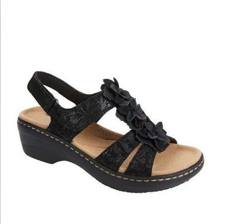 Stylish wedge sandals in a range of vibrant colours, featuring a chic fish mouth design and delicate flower accents for a modern, casual-chic look.