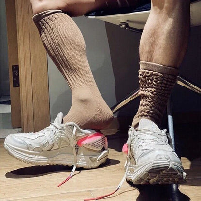 Premium men's breathable terry socks in various solid colours, offering superior moisture-wicking and comfort