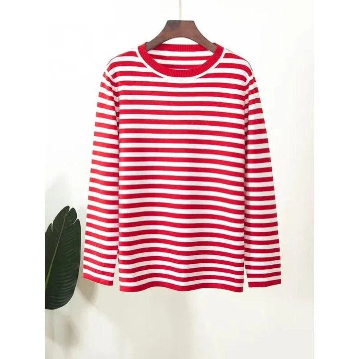 A cosy and stylish knitted stripe jumper for women, featuring a round neckline and full-length sleeves for warmth during the autumn and winter seasons.