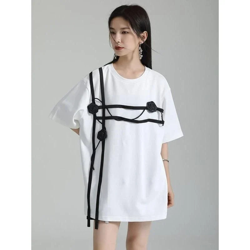 A stylish black and white floral half-sleeve casual t-shirt with a classic round neckline, perfect for everyday wear.